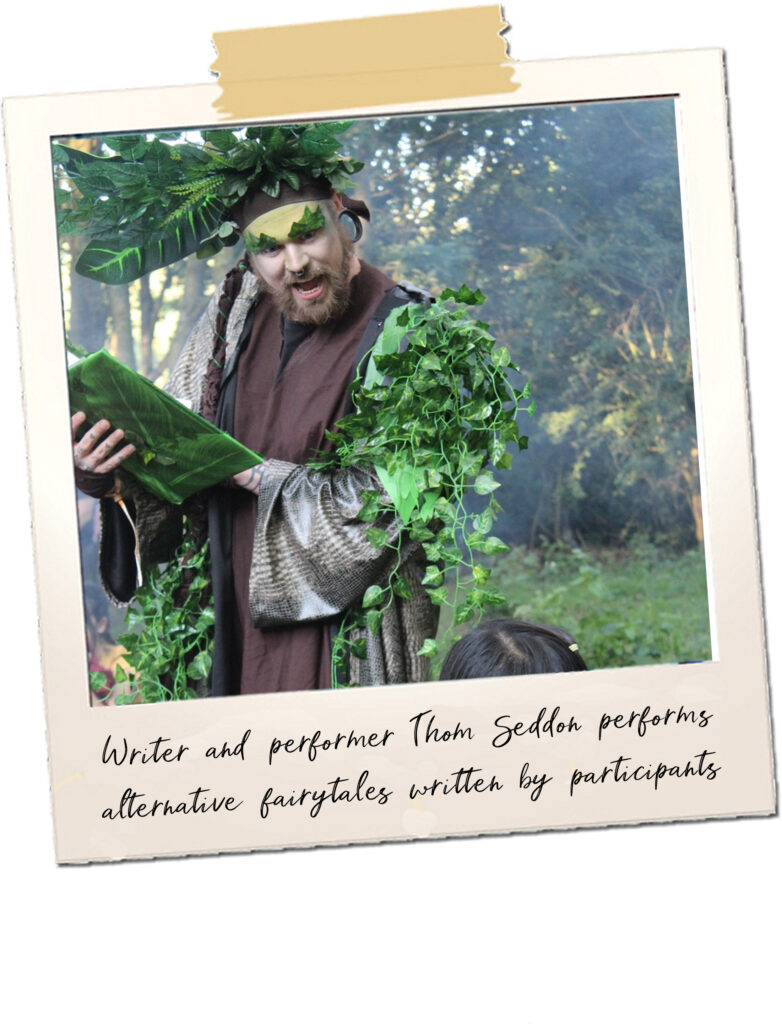 A man dressed in leaves reads from a book